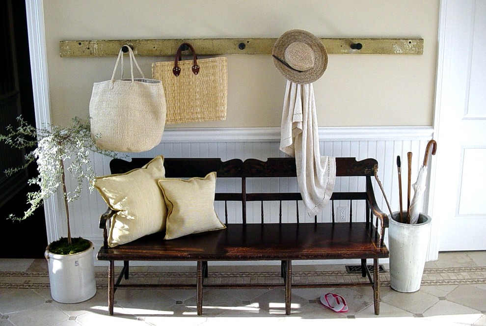 Example of a classic entryway design in New York with beige walls