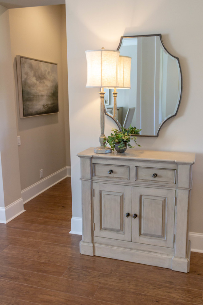 Photo of a medium sized classic foyer in Other with medium hardwood flooring, a double front door and a dark wood front door.