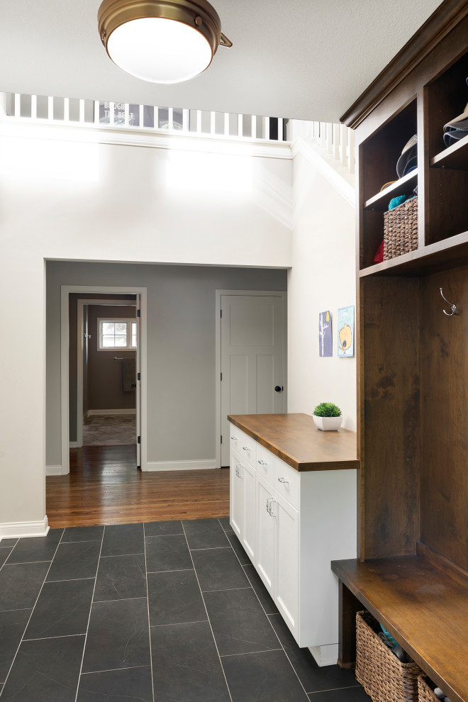 This is an example of a small classic entrance in Minneapolis with slate flooring and grey floors.