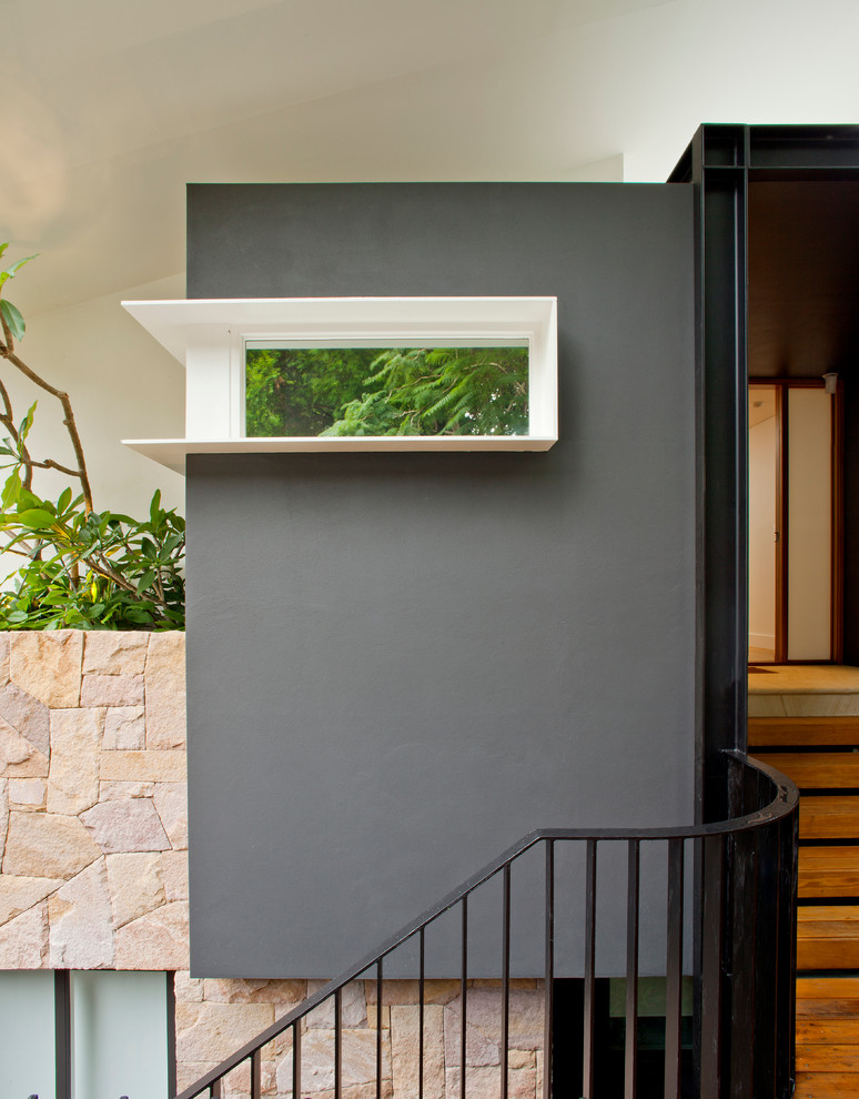 Entryway - contemporary light wood floor entryway idea in Sydney with gray walls