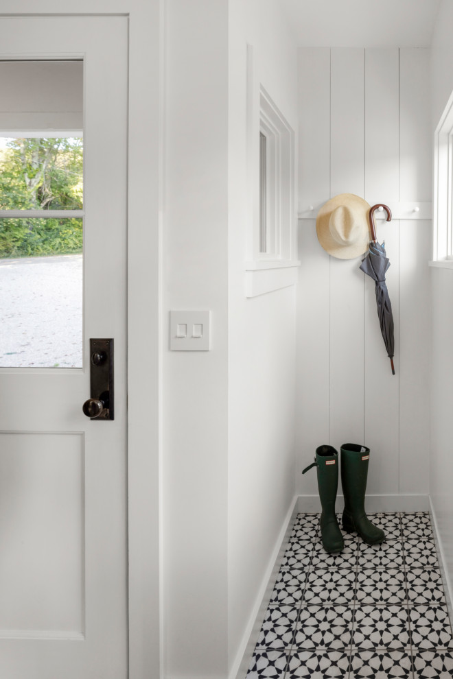 Design ideas for a small scandinavian boot room in Boston with white walls, ceramic flooring, a single front door, a white front door, multi-coloured floors and tongue and groove walls.