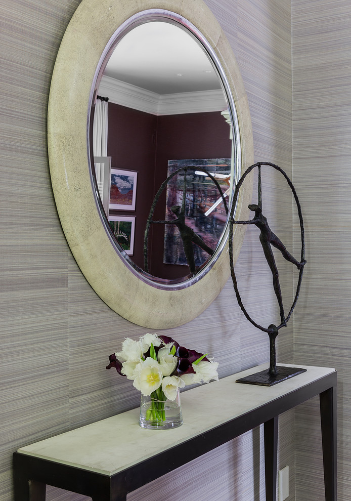 Example of a huge transitional marble floor foyer design in Boston with purple walls