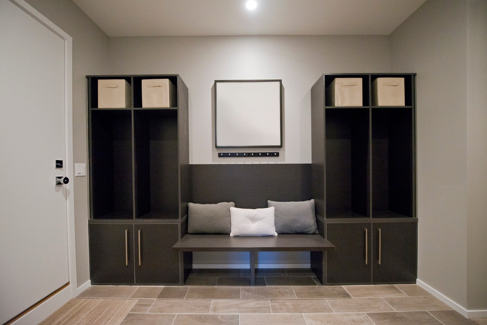This is an example of a medium sized modern boot room in Chicago with grey walls and porcelain flooring.