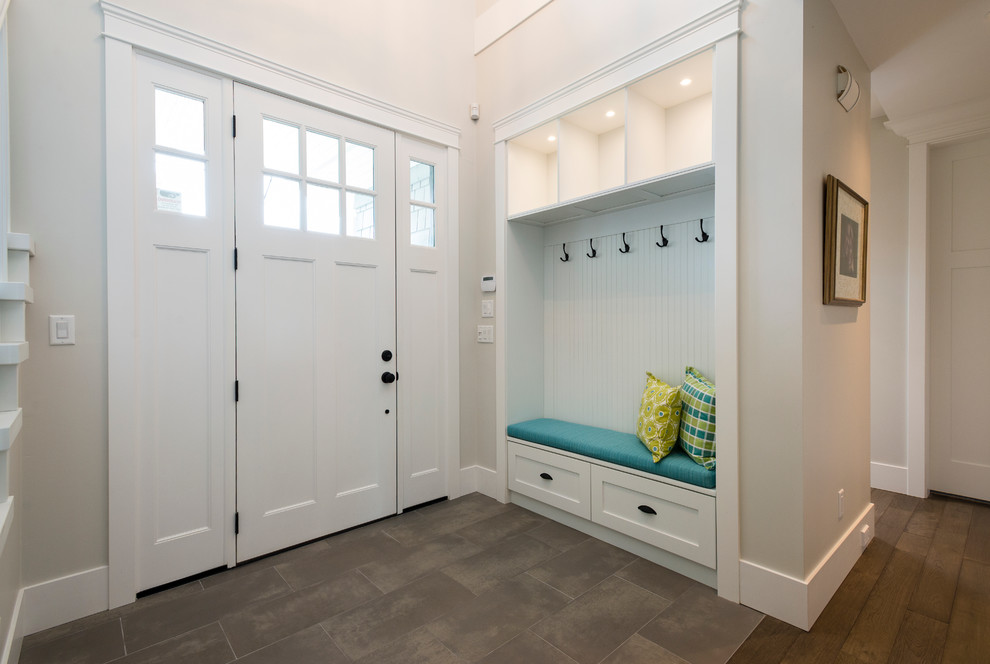 Mid-sized transitional porcelain tile entryway photo in Vancouver with gray walls and a white front door