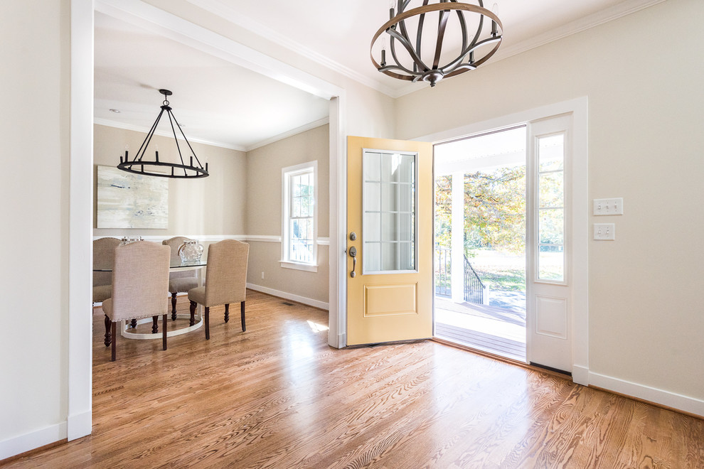 Design ideas for a medium sized farmhouse foyer in Richmond with beige walls, medium hardwood flooring, a single front door and a yellow front door.