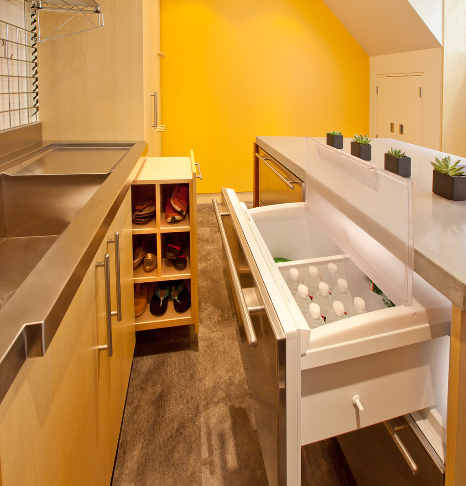 Contemporary boot room in Boston with yellow walls.