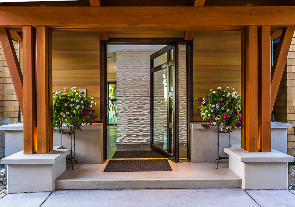 バンクーバーにあるラグジュアリーなコンテンポラリースタイルのおしゃれな玄関ドア (ガラスドア) の写真