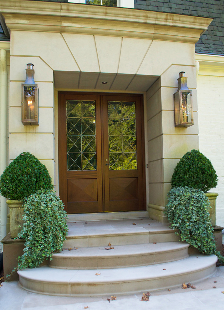 Elegant entryway photo in Atlanta with a dark wood front door