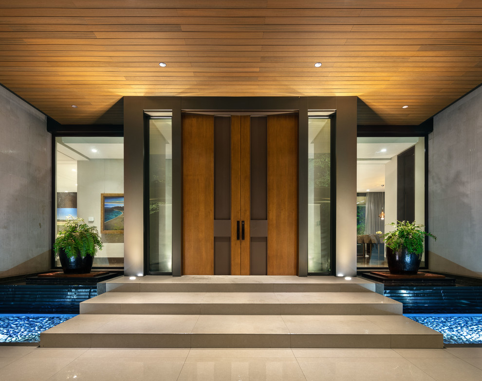 Inspiration for a contemporary double front door remodel with a medium wood front door