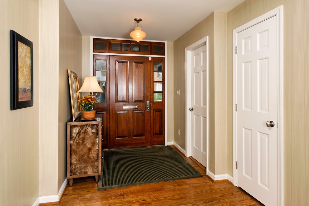 Example of a classic entryway design in DC Metro with beige walls