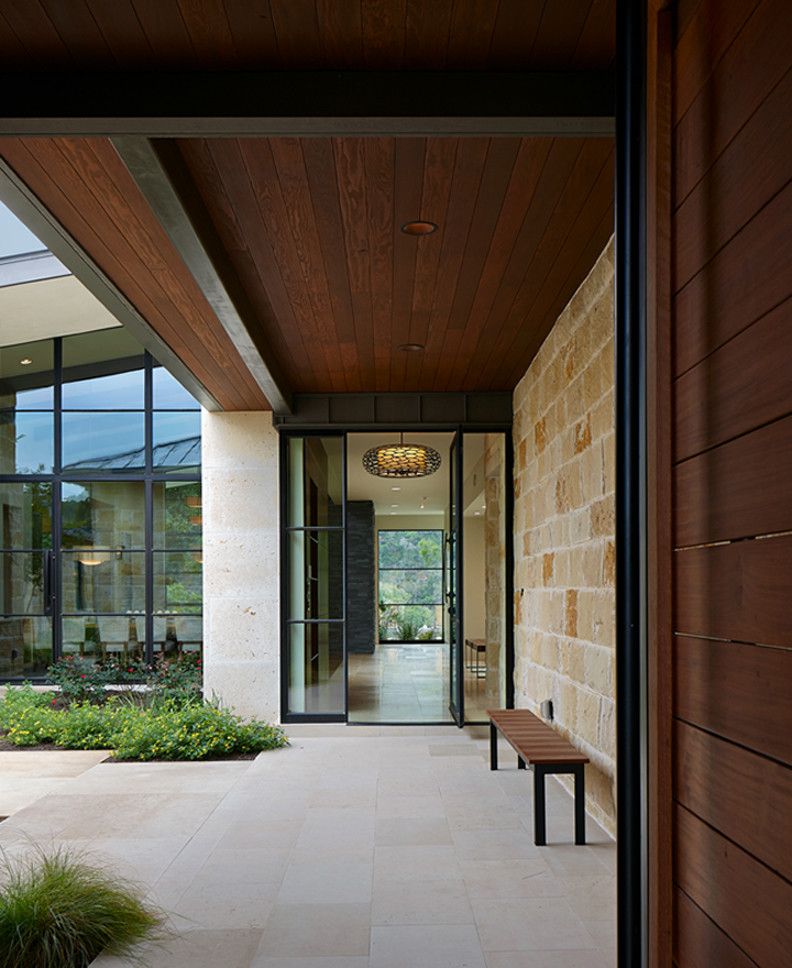 Entryway - contemporary entryway idea in Austin with a metal front door