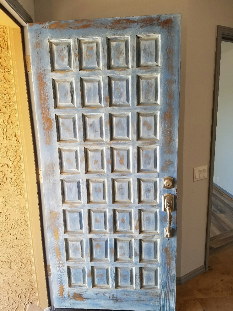 Inspiration for a medium sized rustic front door in Phoenix with beige walls, a single front door and a blue front door.