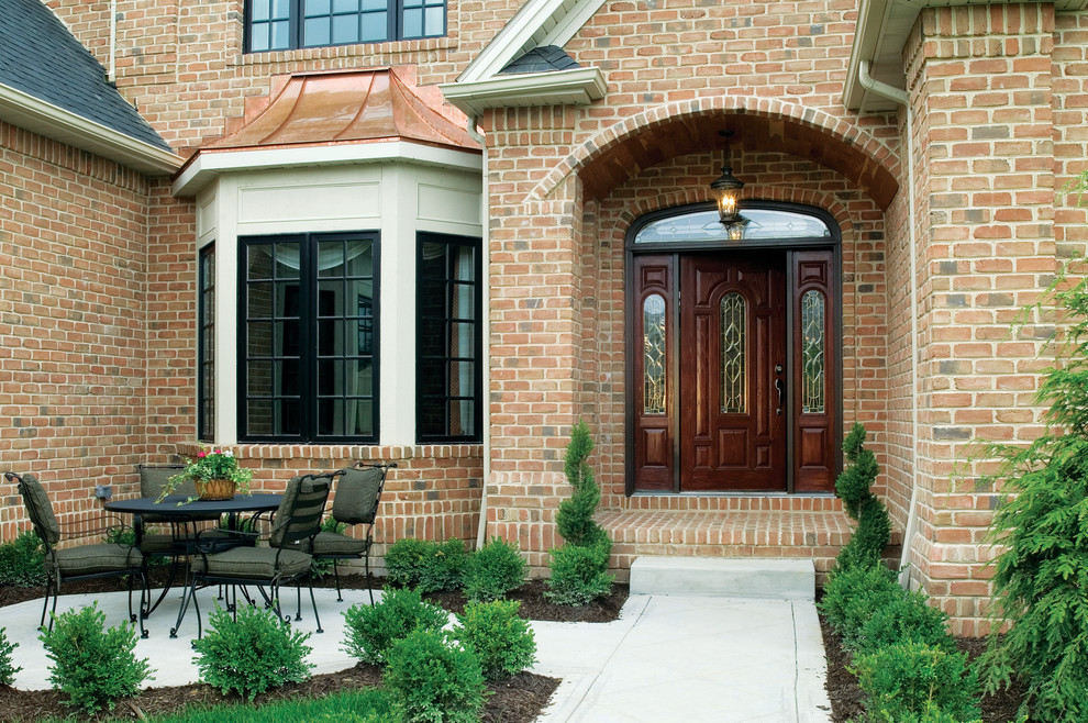 This is an example of a medium sized traditional entrance in Tampa with ceramic flooring.