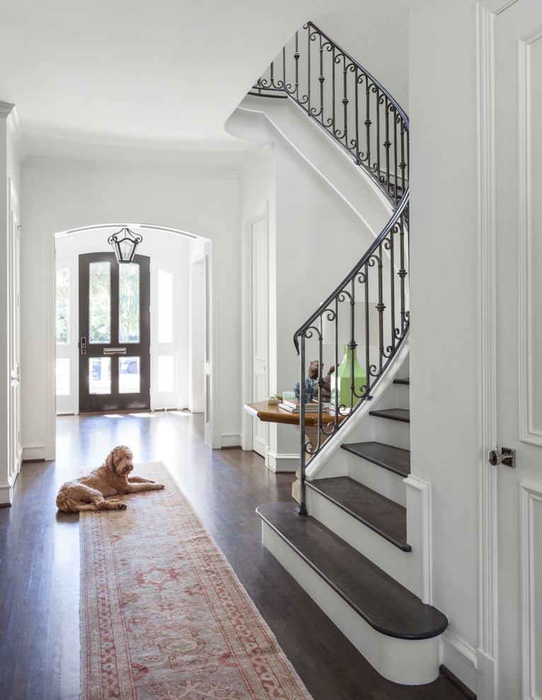 Inspiration for a transitional dark wood floor entryway remodel in Dallas with white walls and a glass front door