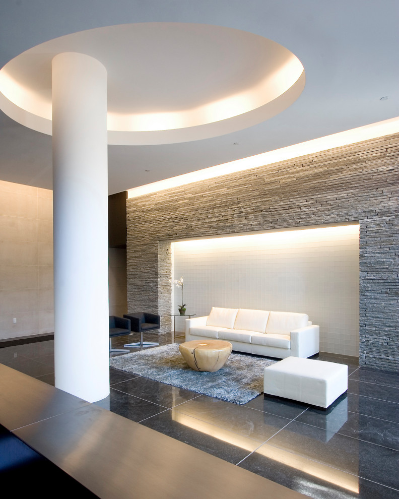 Идея дизайна: фойе среднего размера в стиле модернизм с серыми стенами, мраморным полом, черным полом и кессонным потолком