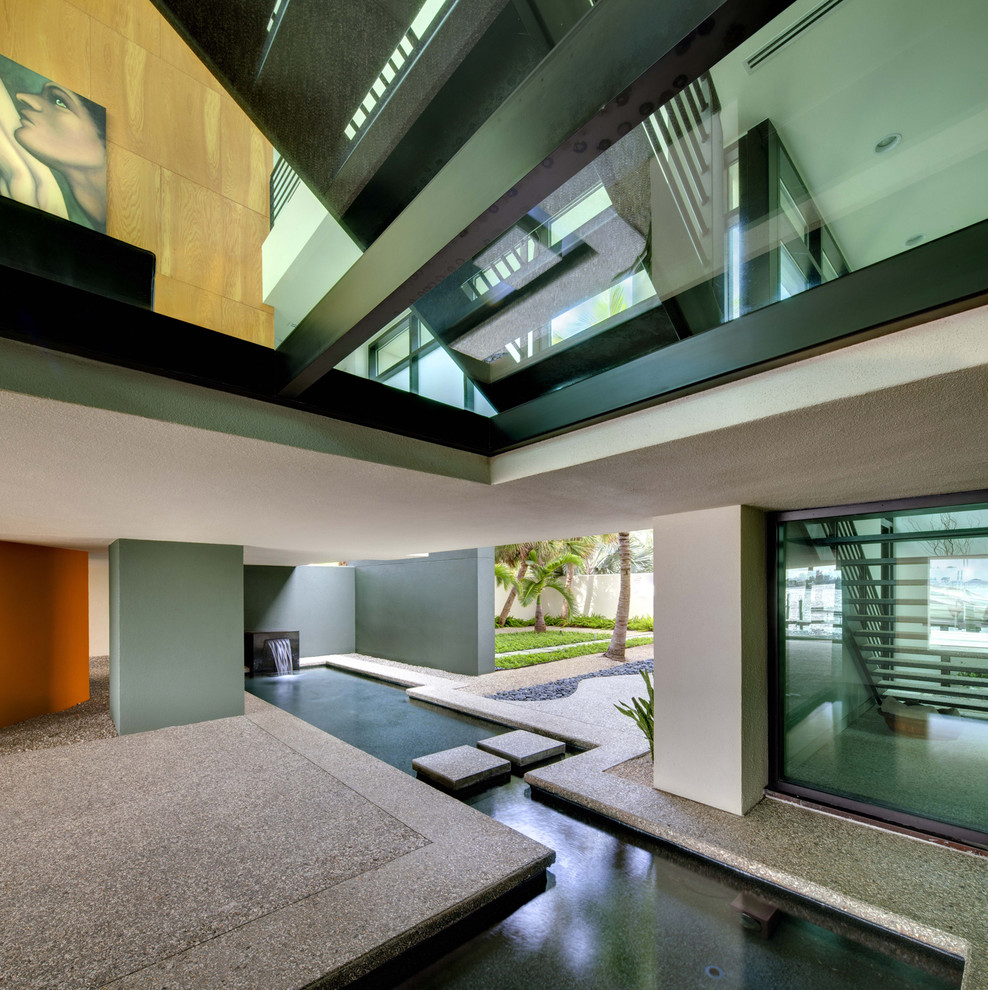 Entryway - contemporary concrete floor entryway idea in Tampa