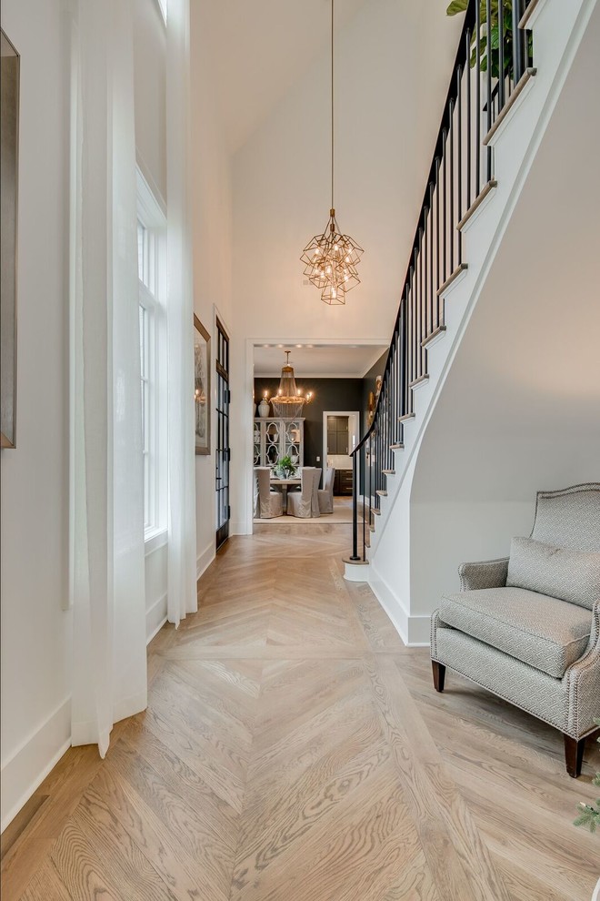 Inspiration for a medium sized classic hallway in Other with white walls, medium hardwood flooring, a single front door, a glass front door and brown floors.