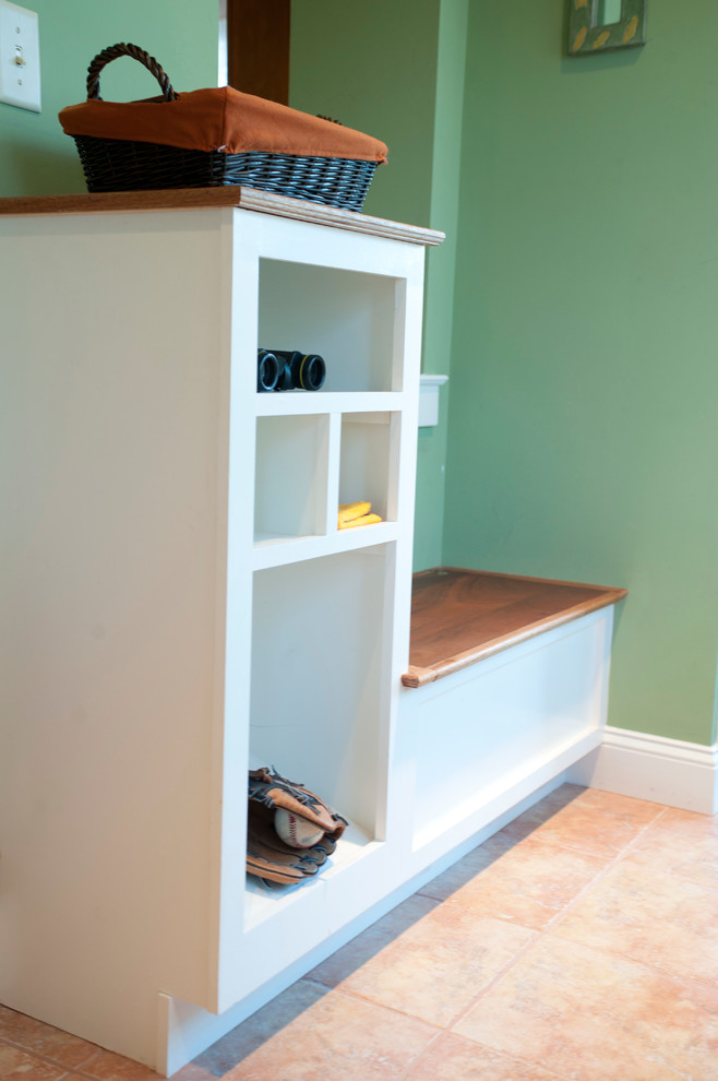 Example of a small minimalist ceramic tile mudroom design in Philadelphia with green walls