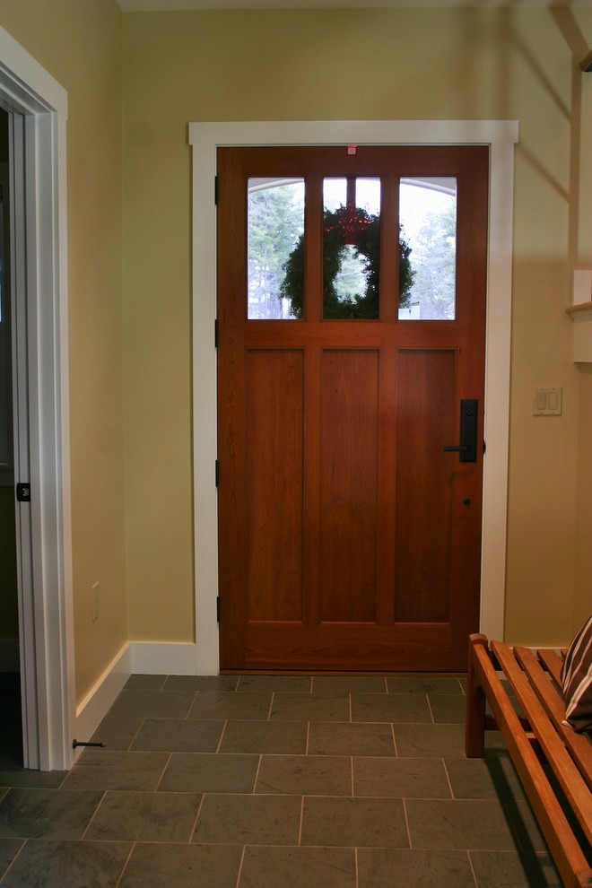Design ideas for a large traditional front door in Burlington with a single front door and a medium wood front door.