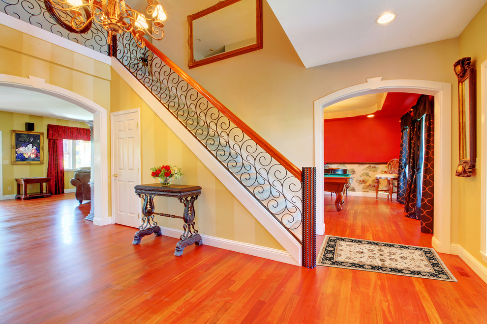 Small classic foyer in Baltimore with beige walls, medium hardwood flooring and a double front door.