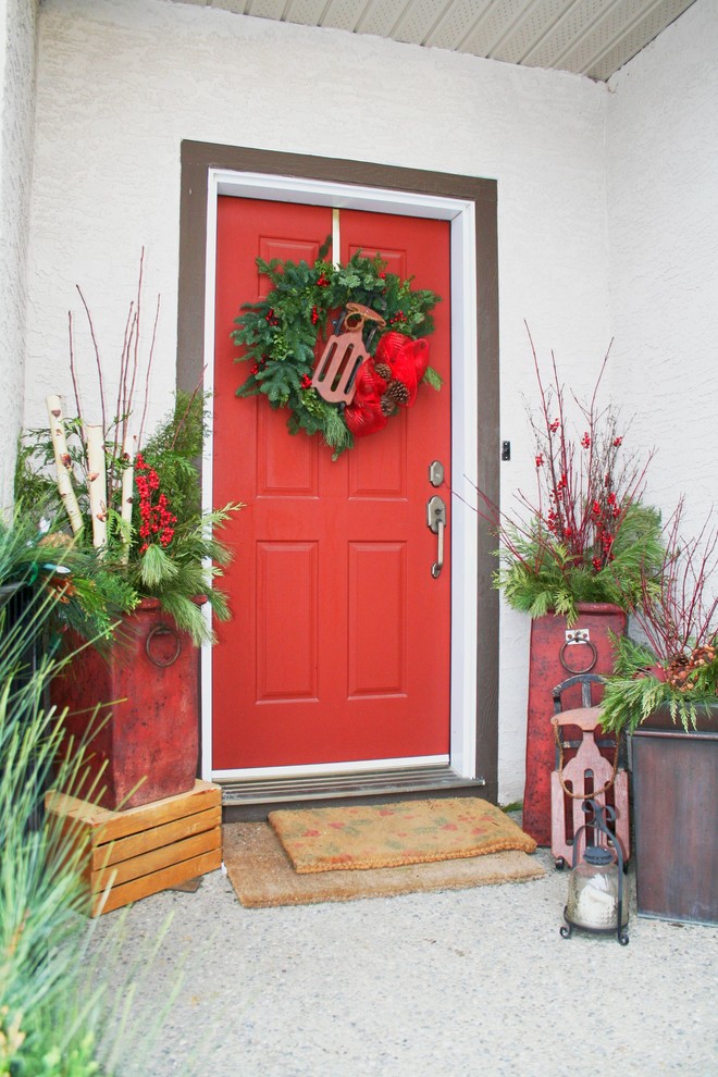 Inspiration for a timeless entryway remodel in Calgary with a red front door