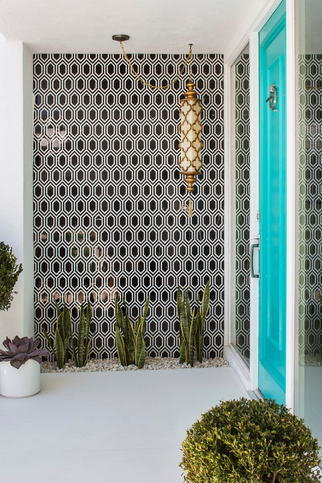 Inspiration for a 1950s entryway remodel in Los Angeles with a blue front door