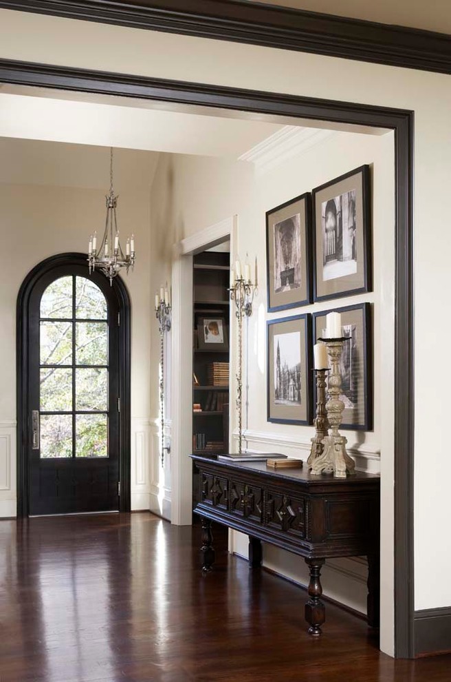 Large elegant dark wood floor single front door photo in Other with a black front door and white walls