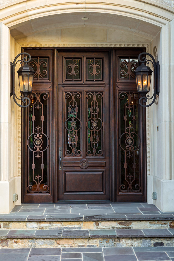 Example of a large classic entryway design in Charlotte with a metal front door