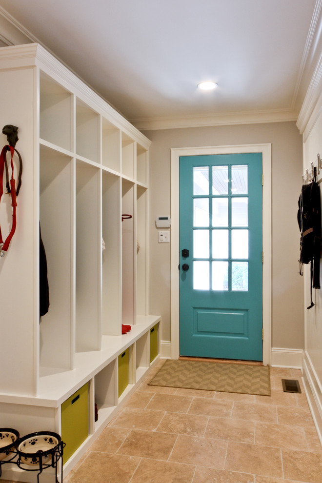 Example of a classic travertine floor entryway design in Newark with gray walls and a blue front door