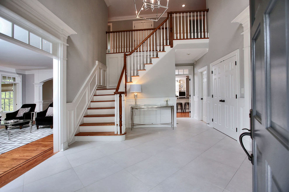 Design ideas for a classic foyer in Miami with grey walls, ceramic flooring, a single front door and a grey front door.