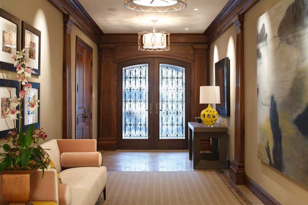 Entry hall - transitional marble floor entry hall idea in San Francisco with beige walls