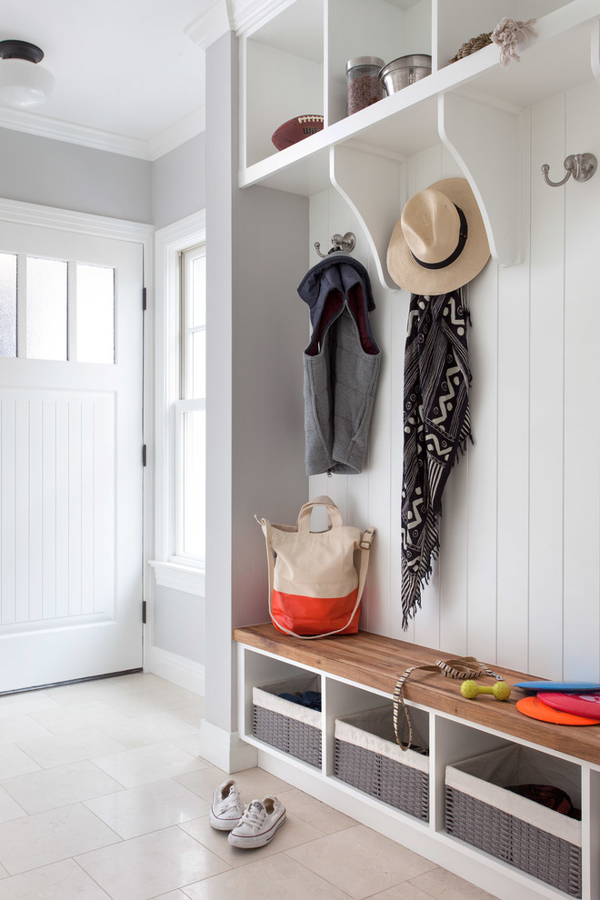 Entryway - traditional entryway idea in Austin with gray walls and a white front door