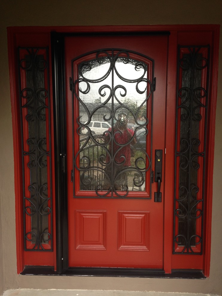 Entryway photo in Los Angeles with brown walls and a red front door