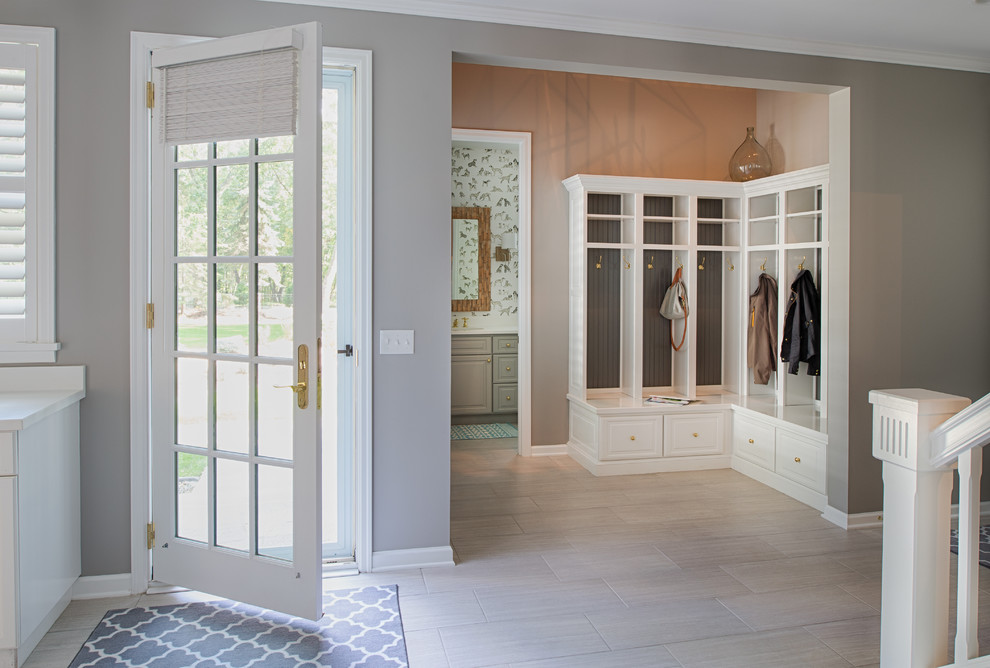 Inspiration for a beach style foyer in Minneapolis with grey walls, a single front door and a glass front door.