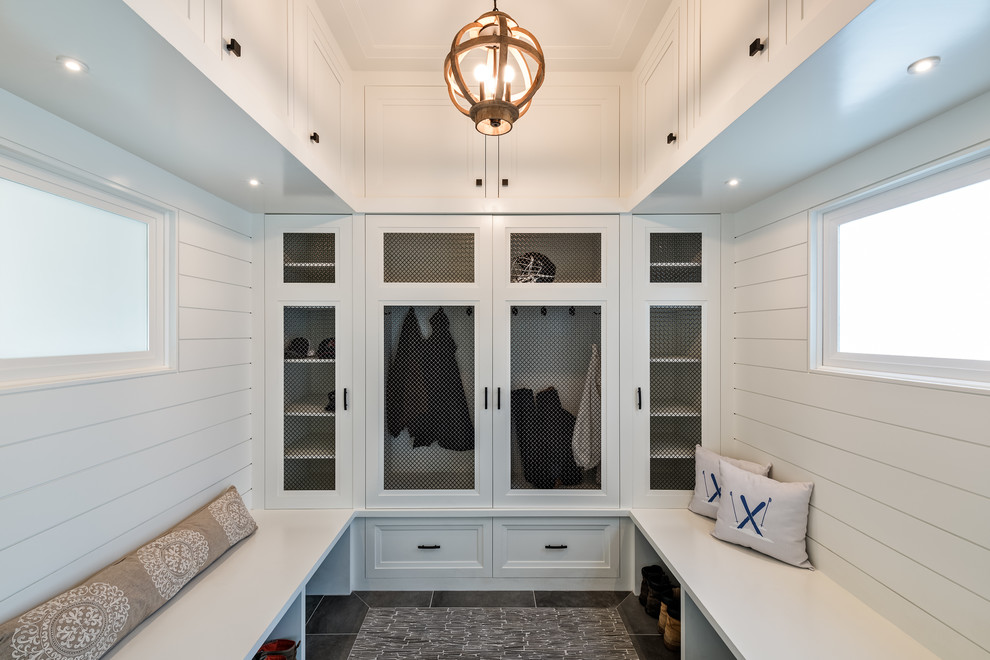 Design ideas for a nautical boot room in Boston with white walls and grey floors.