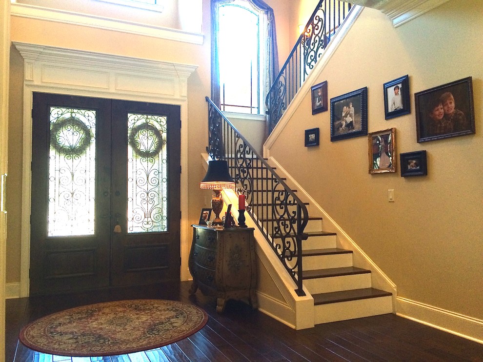 Inspiration for a large classic foyer in Miami with beige walls, dark hardwood flooring, a double front door and a dark wood front door.