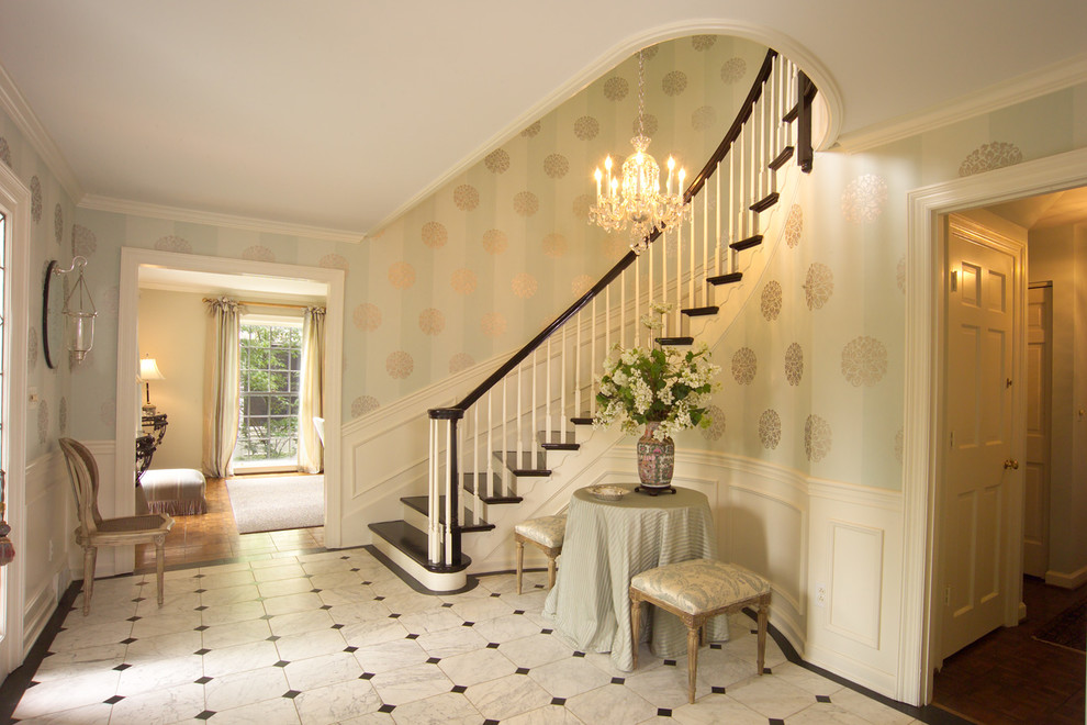 Design ideas for a traditional foyer in Louisville with multi-coloured walls and marble flooring.