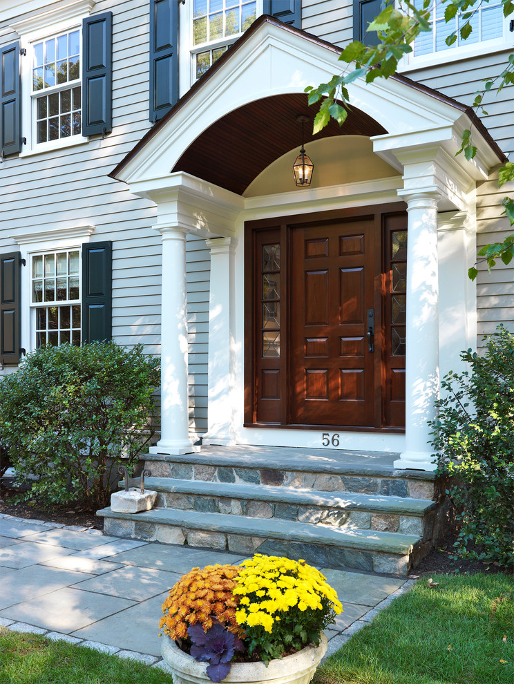 Classic entrance in Boston with a dark wood front door.