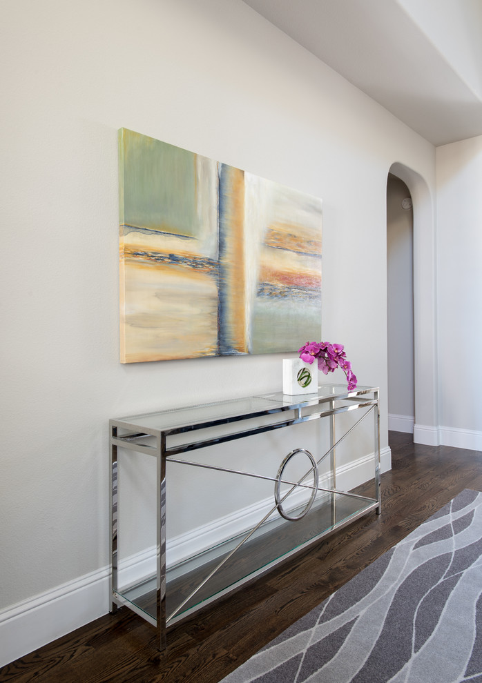 Entry hall - mid-sized contemporary dark wood floor entry hall idea in Dallas with gray walls