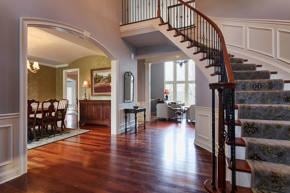 Photo of an expansive classic foyer in Columbus with grey walls, dark hardwood flooring, a double front door and a medium wood front door.