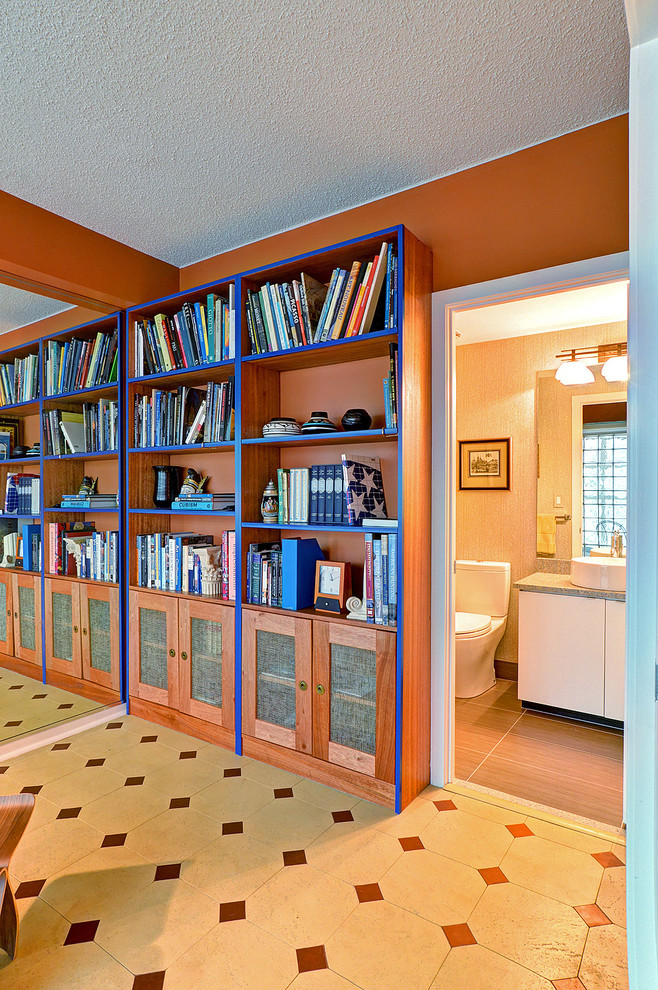 Example of a mid-sized trendy cork floor entryway design in Portland Maine with orange walls