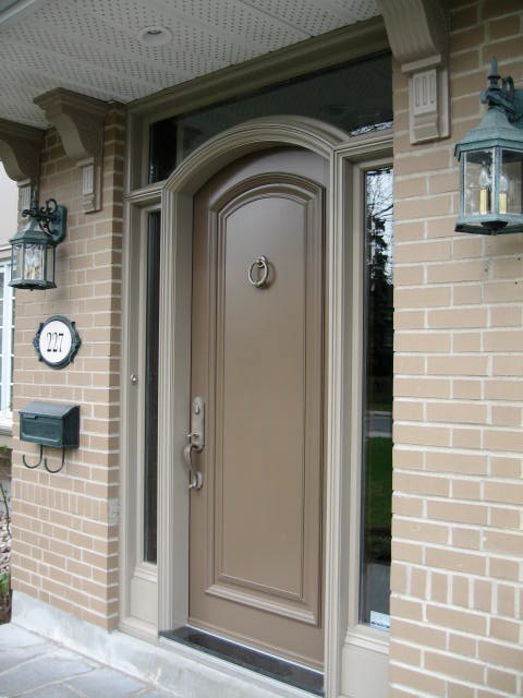 Inspiration for a medium sized front door in Toronto with a single front door and a brown front door.