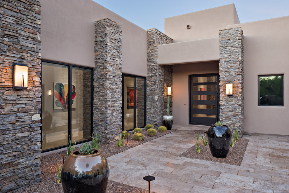 Inspiration for a contemporary entrance in Phoenix with a grey front door and grey walls.