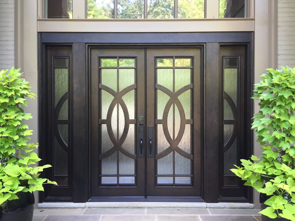 Entryway - large contemporary entryway idea in Charlotte with a brown front door