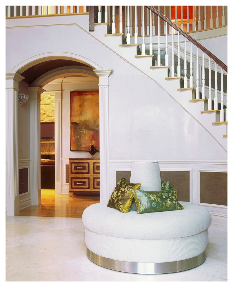 Foyer - mid-sized contemporary marble floor foyer idea in New York with white walls