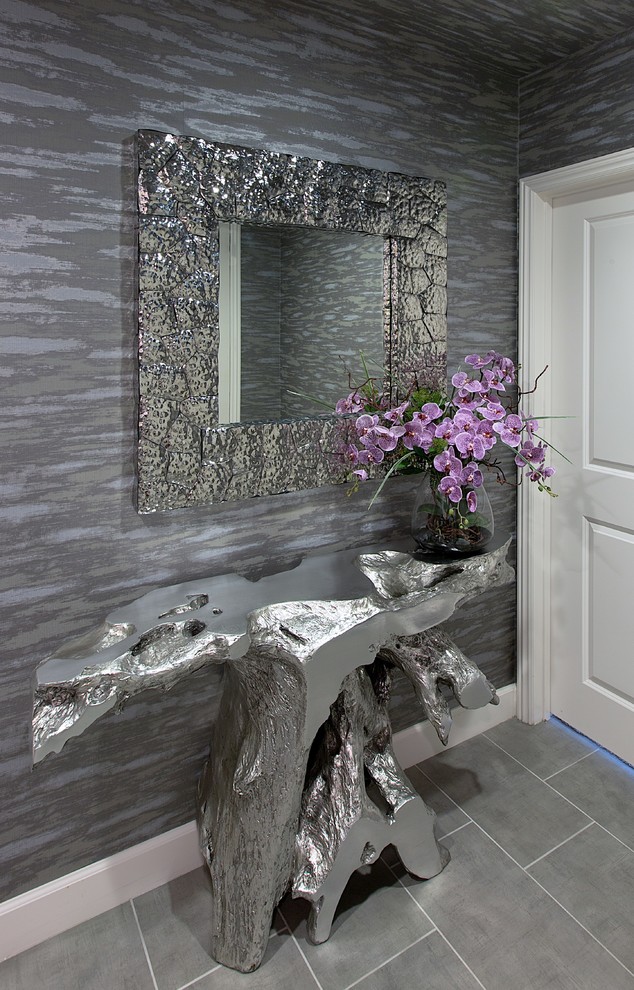 Example of a small trendy ceramic tile entryway design in Los Angeles with gray walls