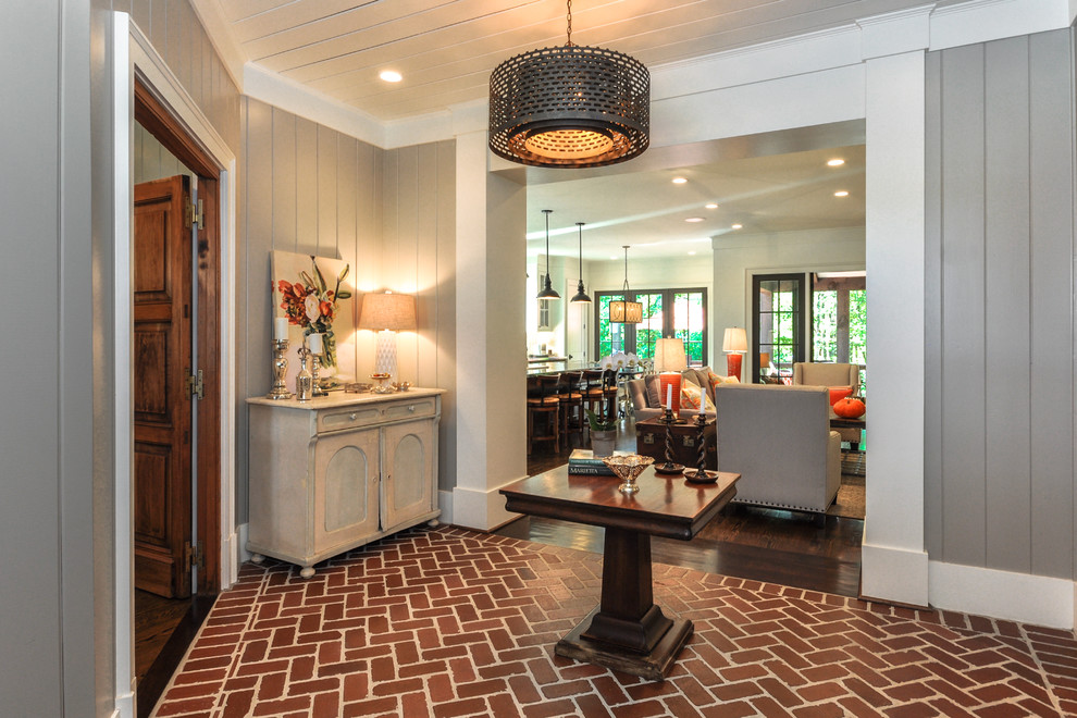 Contemporary foyer in Atlanta with grey walls, brick flooring, a single front door, a white front door and red floors.