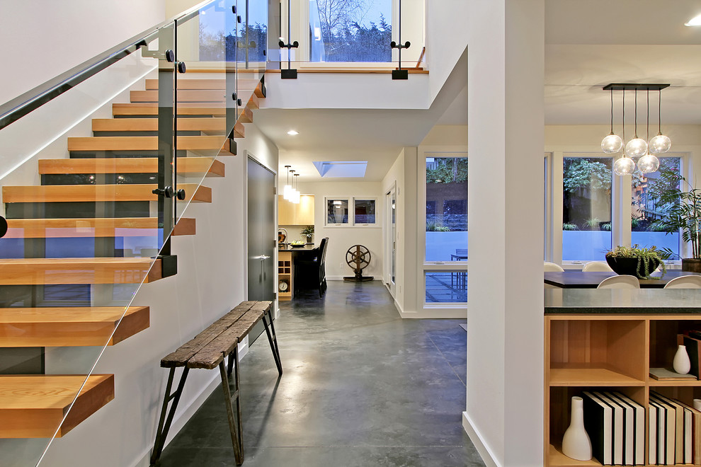 Contemporary entrance in Seattle with concrete flooring.