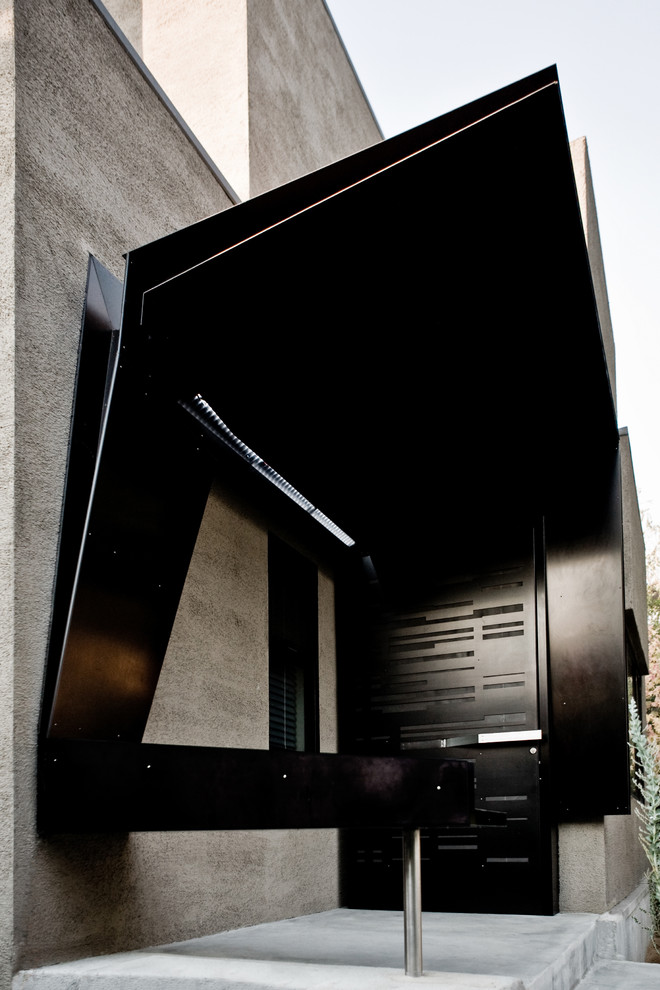 Inspiration for a contemporary entrance in Los Angeles with a black front door.