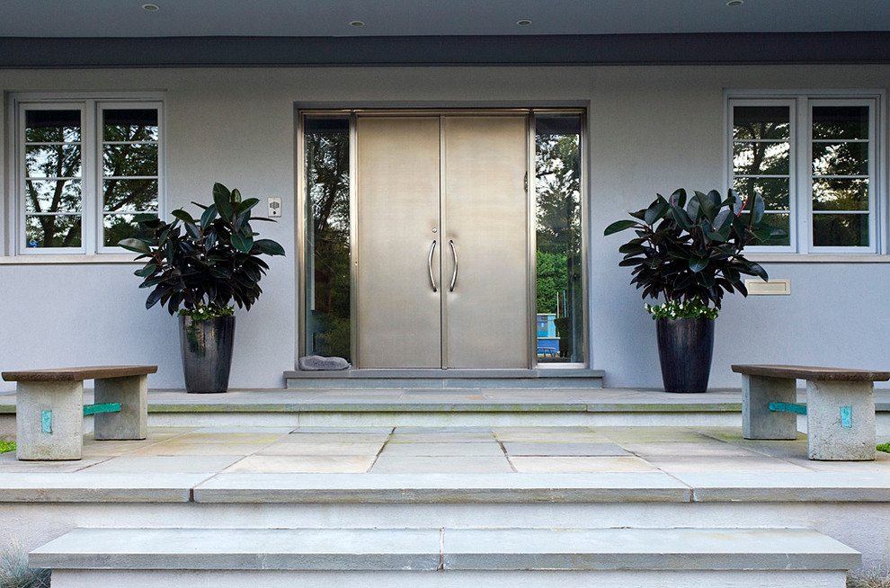 Photo of a contemporary entrance in Chicago with a double front door.